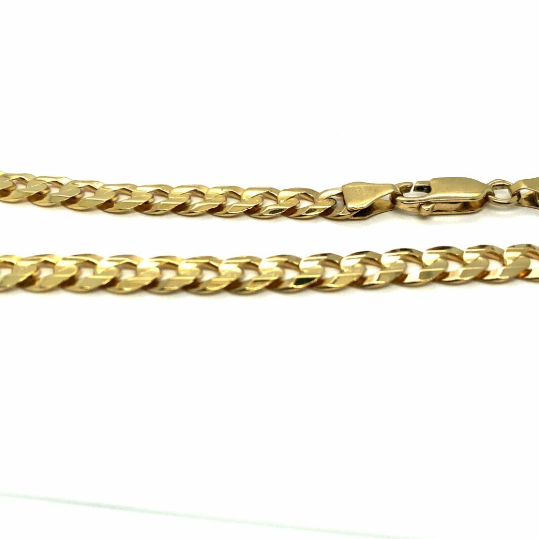 a gold chain is shown on a white background
