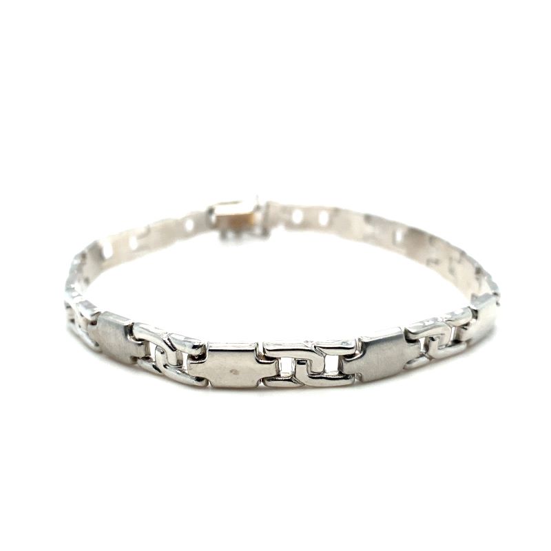 a silver bracelet on a white background