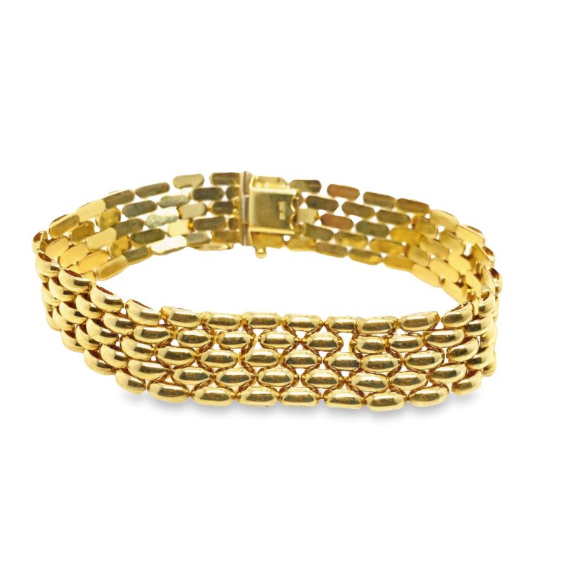 a gold bracelet on a white background