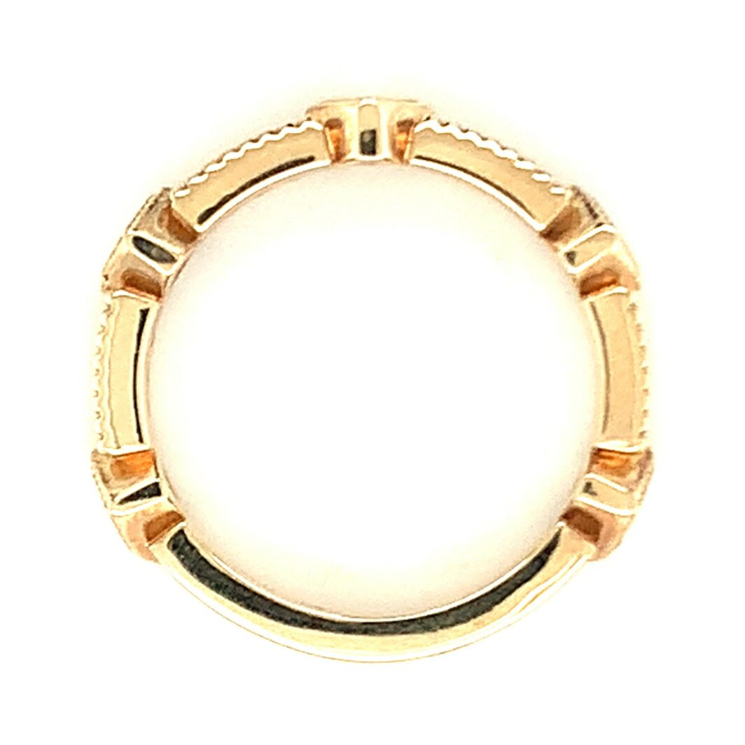 a yellow gold ring is shown against a white background