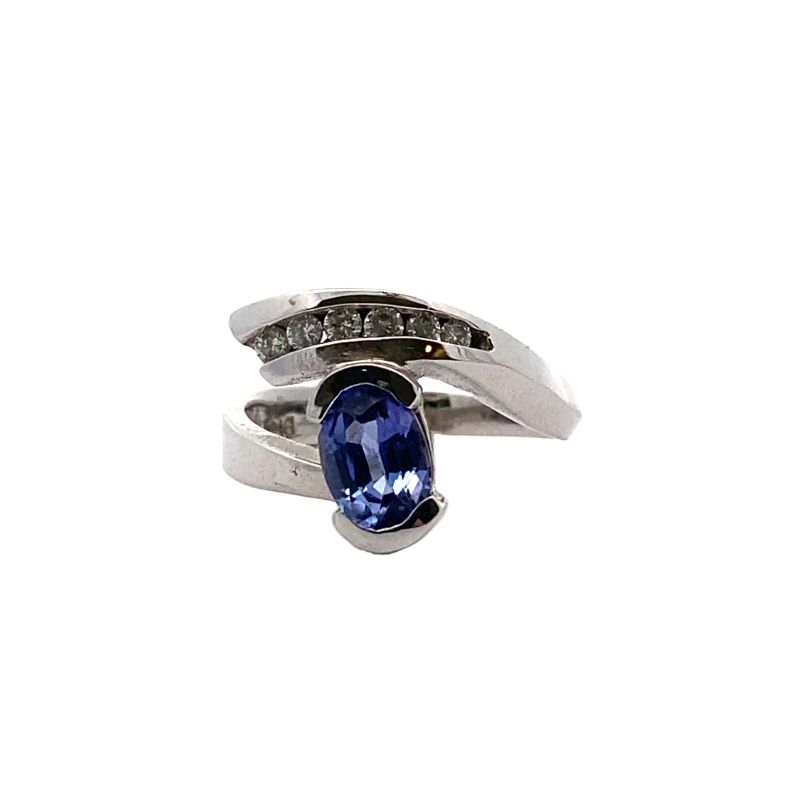 a ring with a blue stone and two diamonds