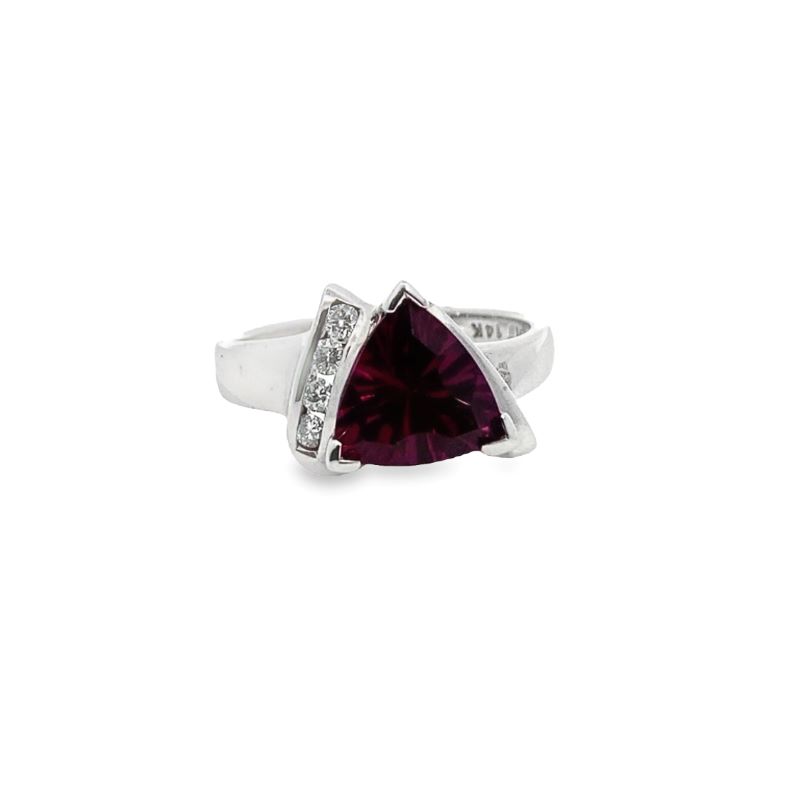 a white gold ring with a purple stone and diamonds