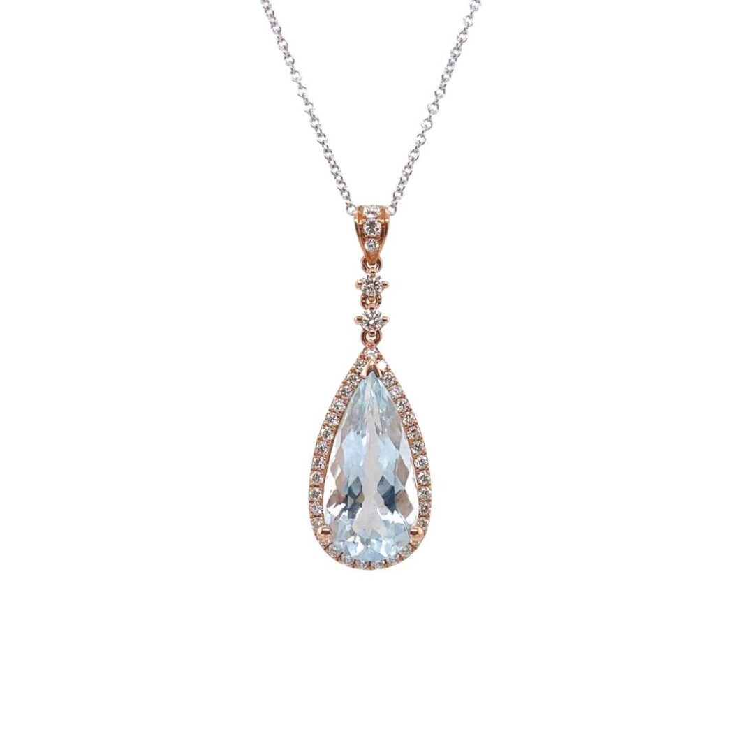 a necklace with an aqua blue tear shaped stone