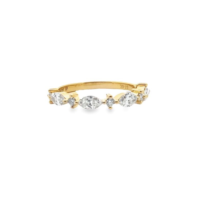 a yellow gold ring with three pear shaped diamonds