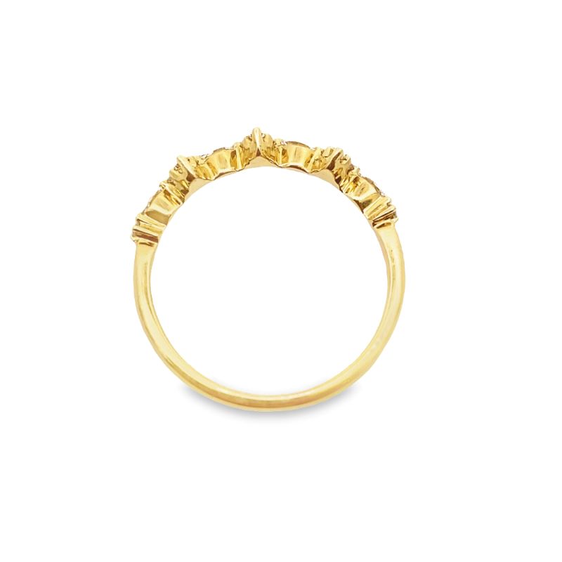 a yellow gold ring with three small diamonds