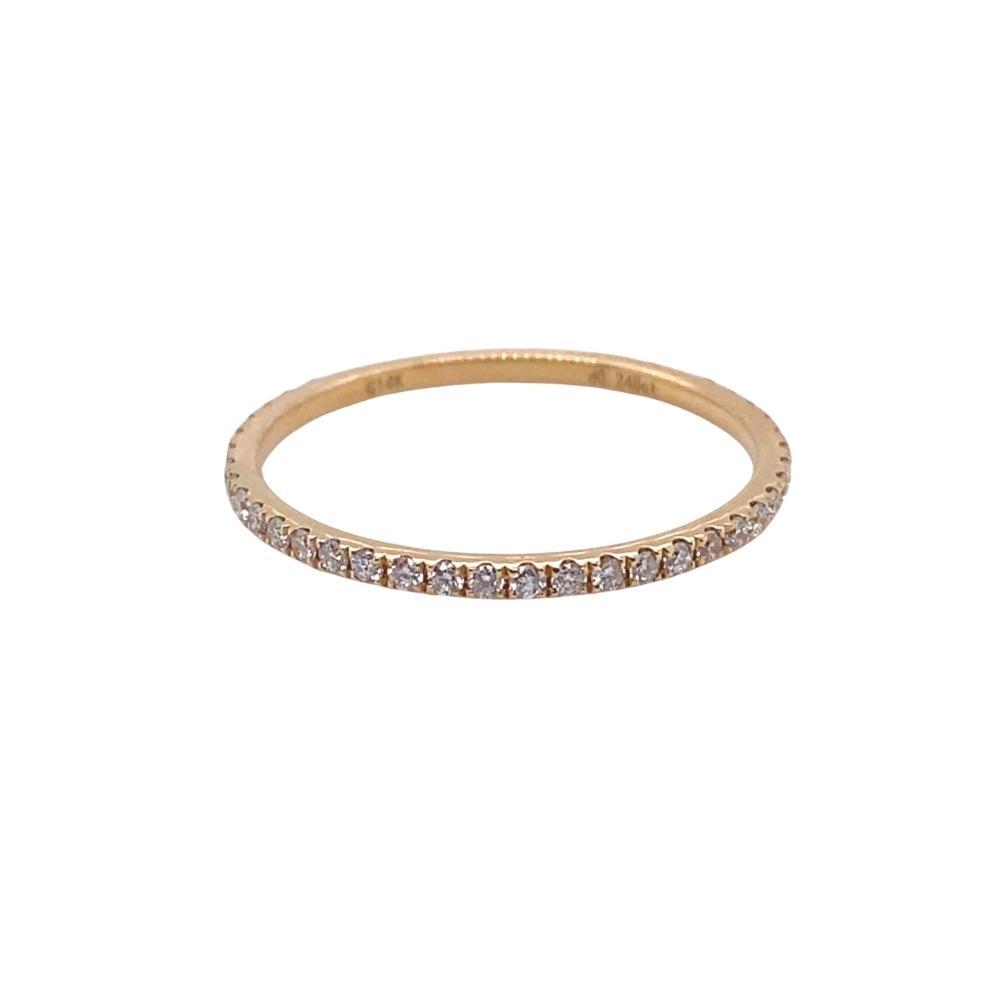 a gold band with small diamonds on it