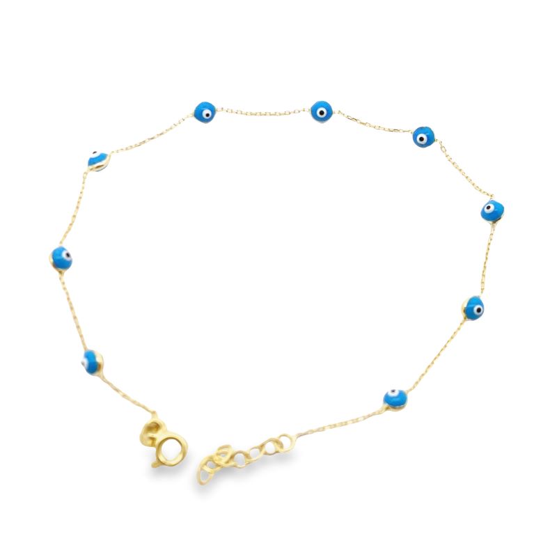 a gold bracelet with blue beads and an evil eye