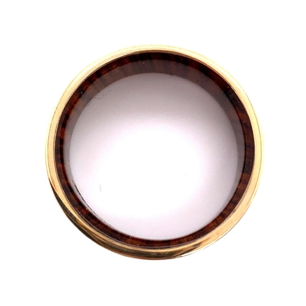a brown and white plate on a white surface