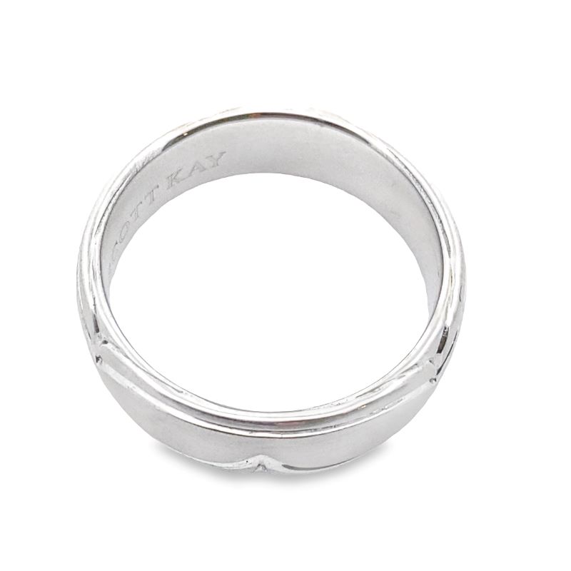 a white gold ring on a white background