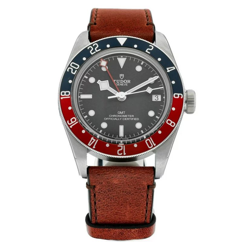 a watch with a red and black dial