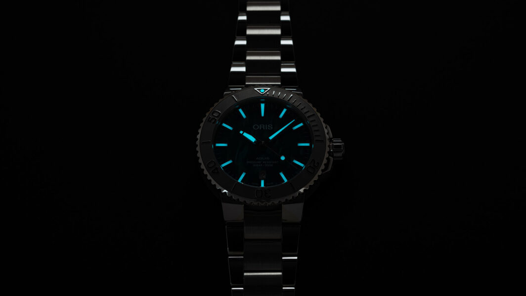a black watch with blue numbers on it