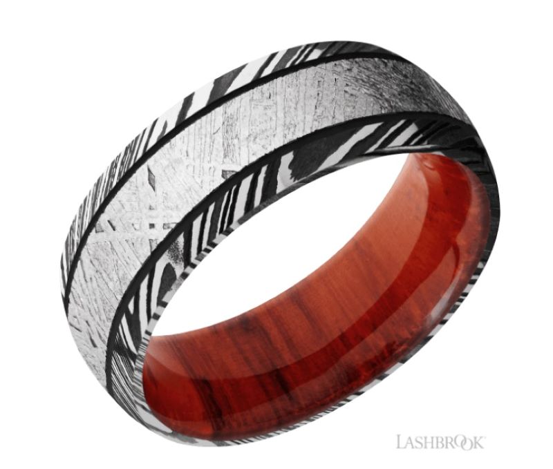 a wedding ring with zebra print and red wood inlay