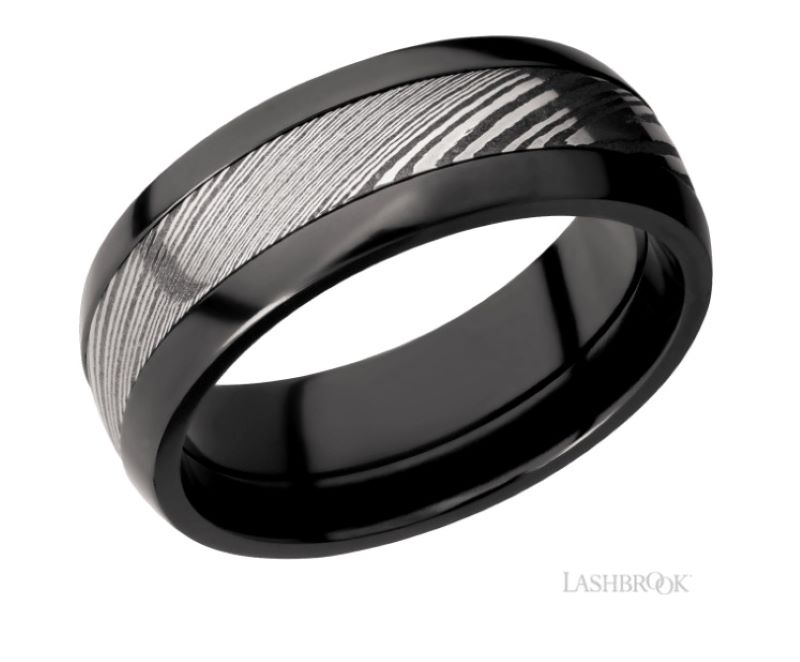 a black and white wedding band with a pattern in the center