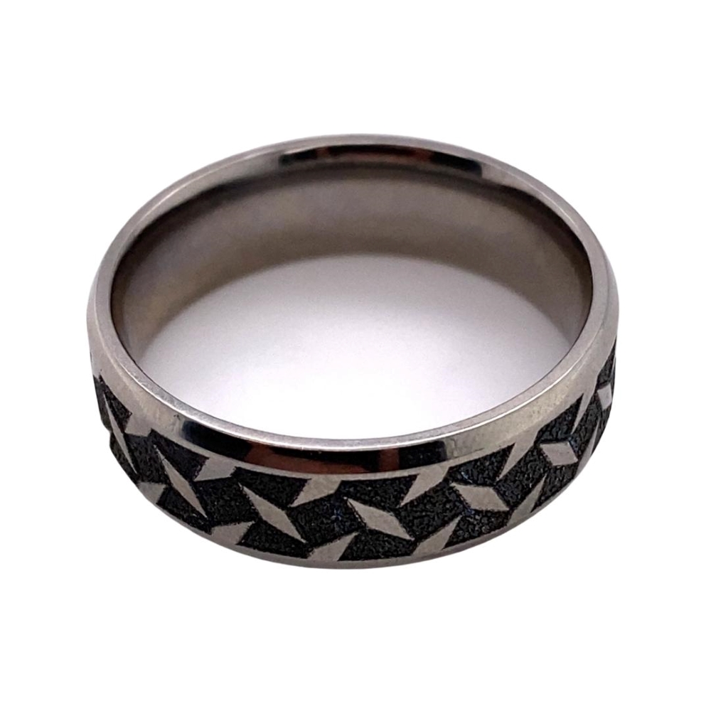 a ring with black and white designs on it