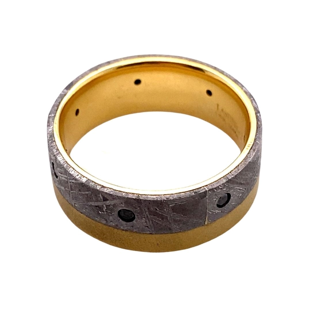 a gold and silver ring on a white background