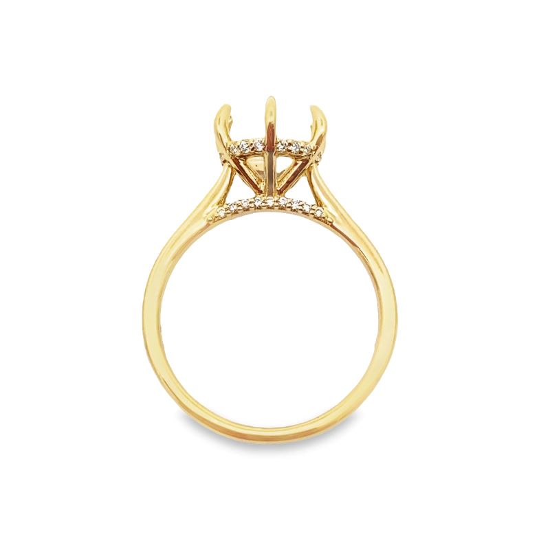 a yellow gold ring with two diamonds on top