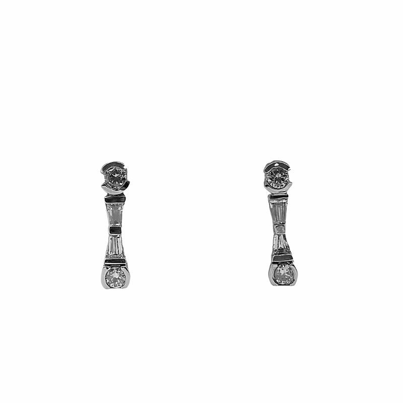 a pair of silver earrings on a white background