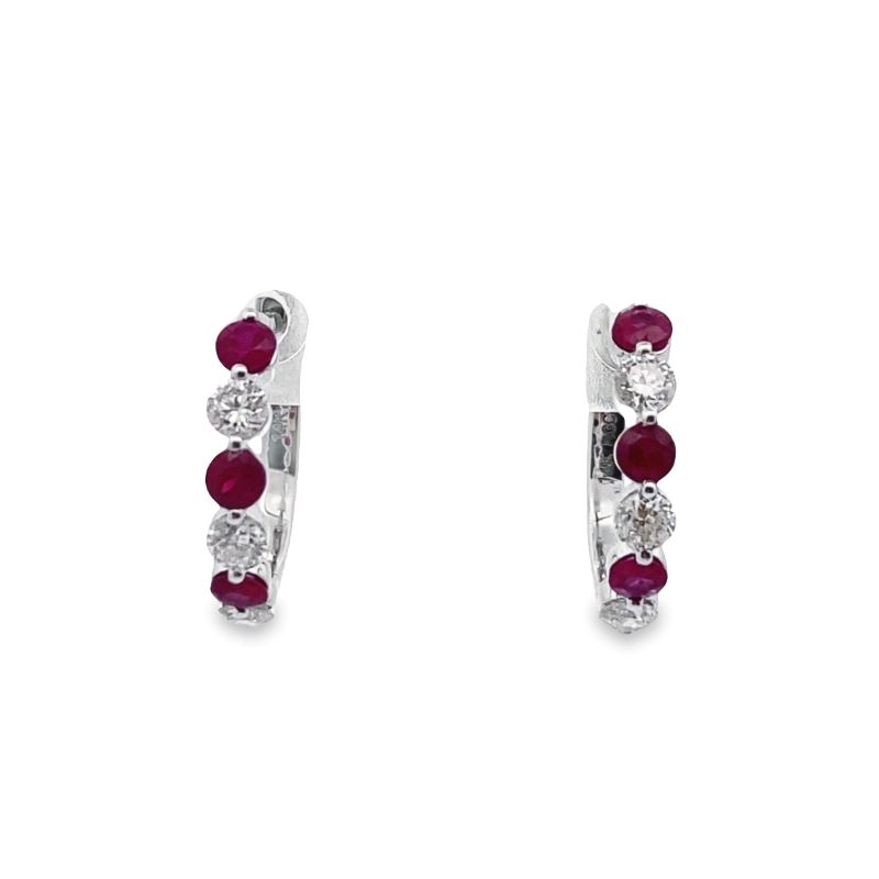 a pair of red and white diamond earrings