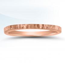 a rose gold wedding ring with a thin band