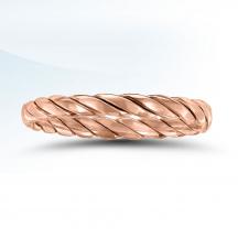 a rose gold ring on a white background