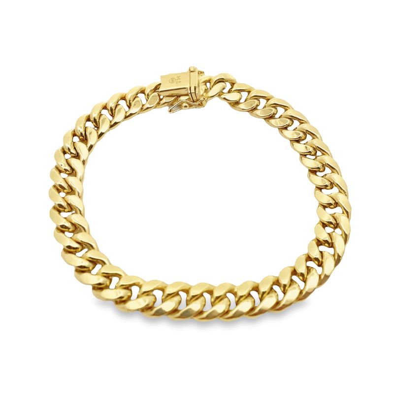 a gold bracelet with a curb