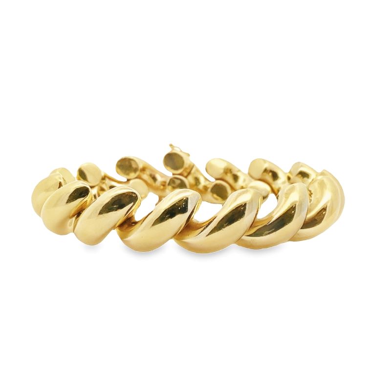 a gold bracelet with twisted links