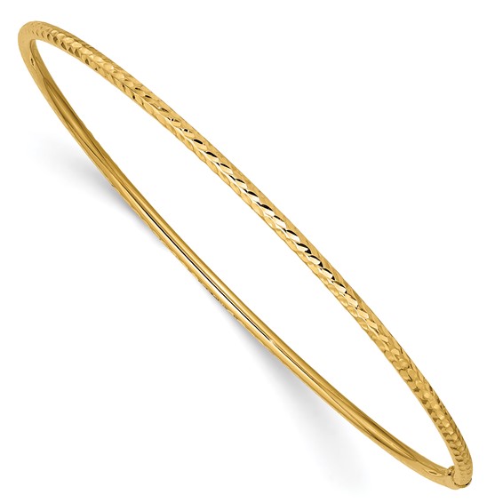 a yellow gold bang bracelet on a white background