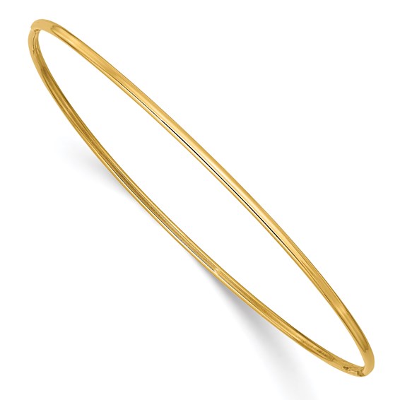 a gold bang bracelet on a white background