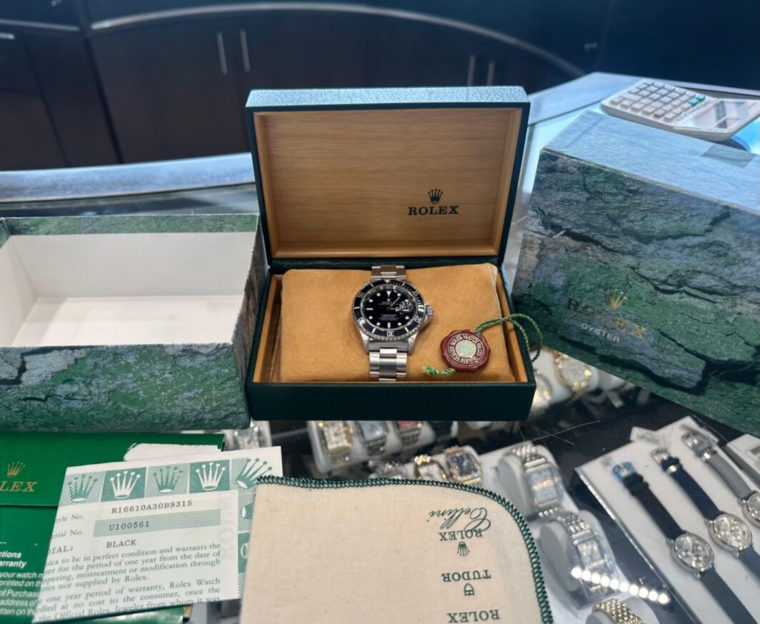a rolex watch in a box on display
