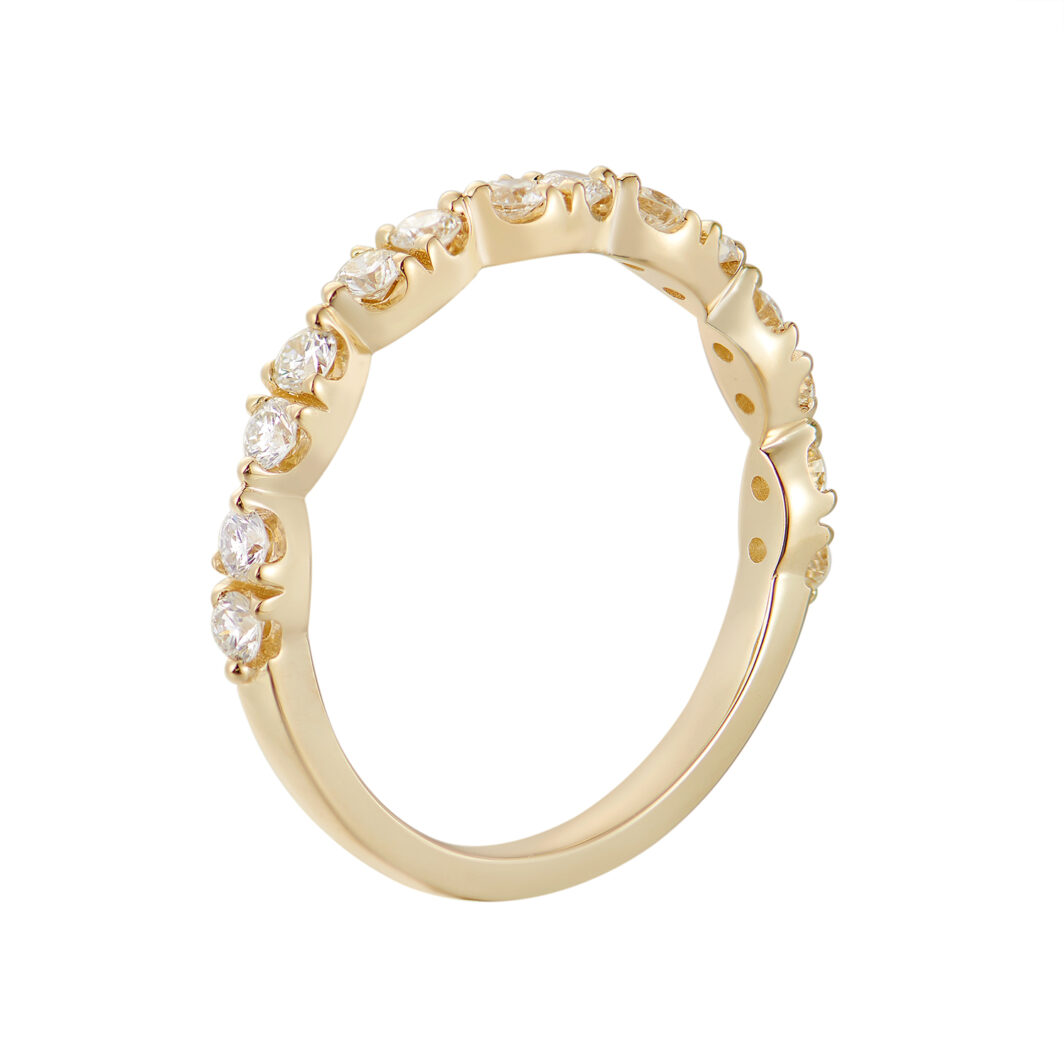 a yellow gold ring with three rows of diamonds