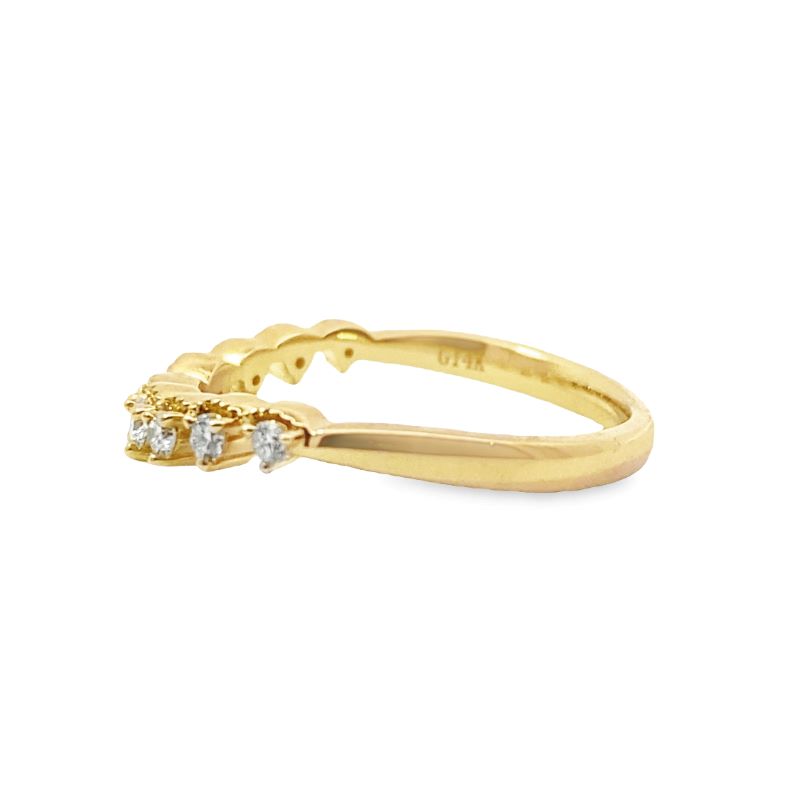 a gold ring with three stones on it
