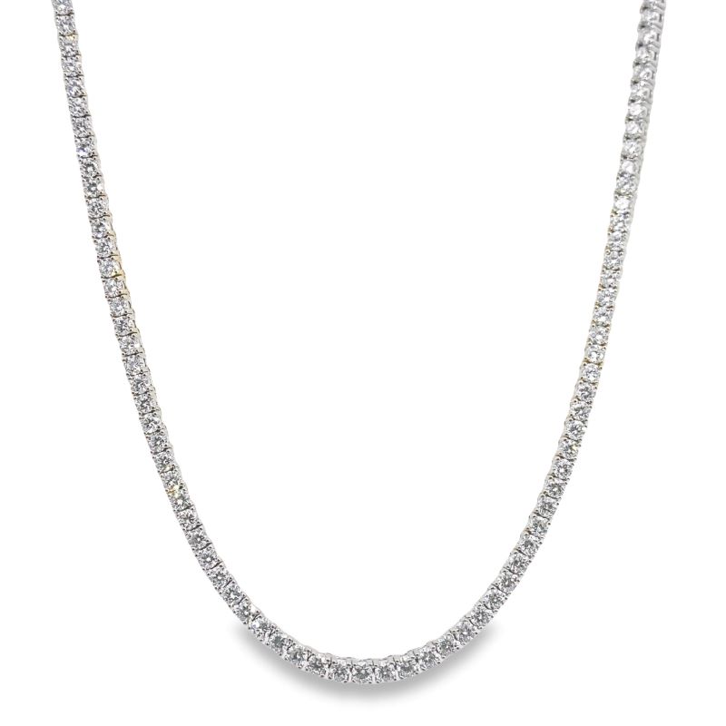 a diamond necklace on a white background