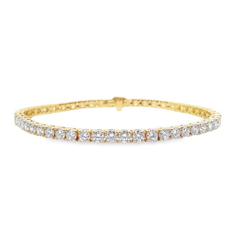 a yellow gold and white diamond bracelet