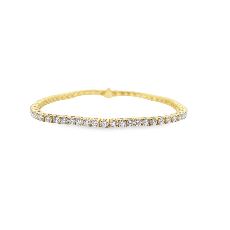 a yellow gold bracelet with white diamonds