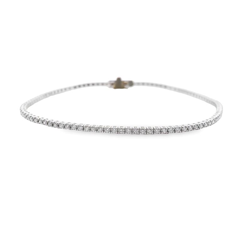 a white bracelet with diamonds on it