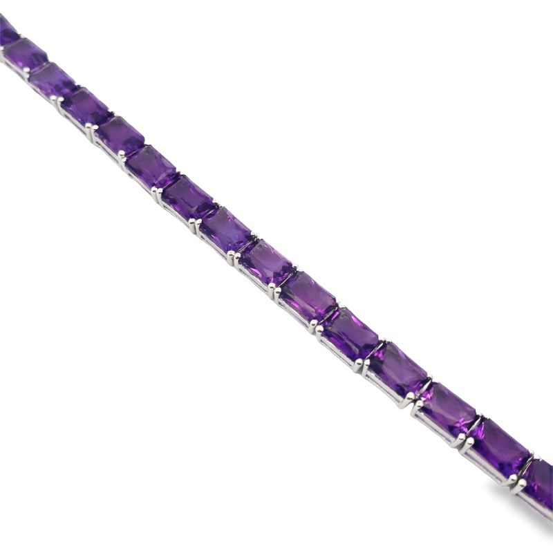 a bracelet with purple stones on it