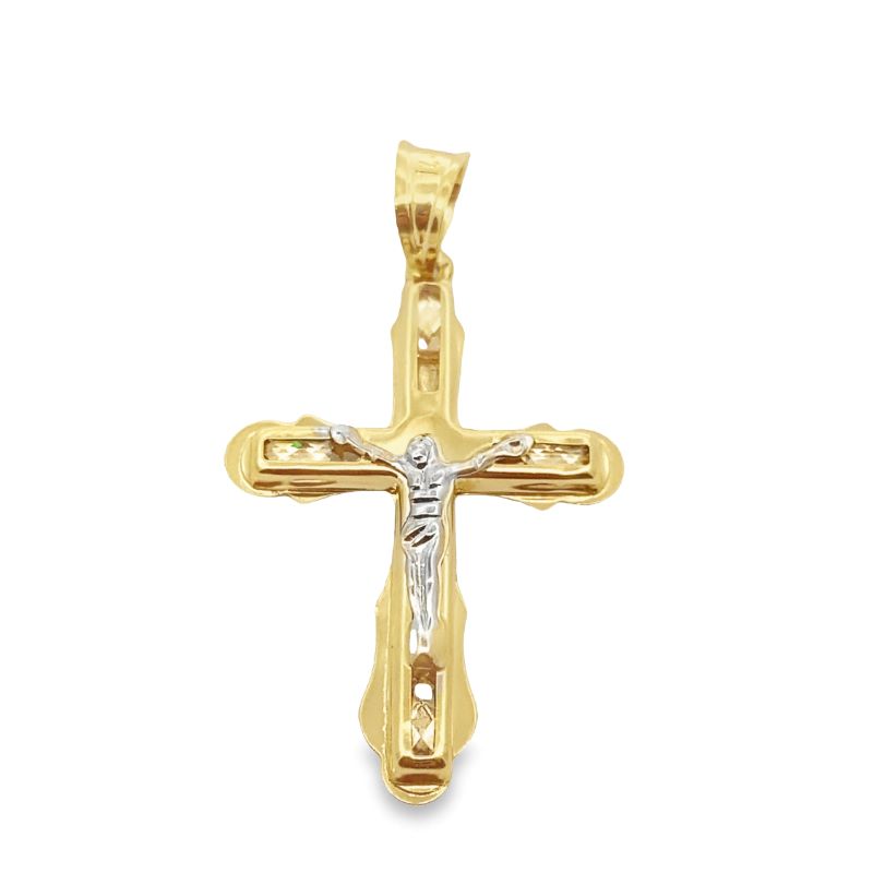 a gold cross with a diamond in the center