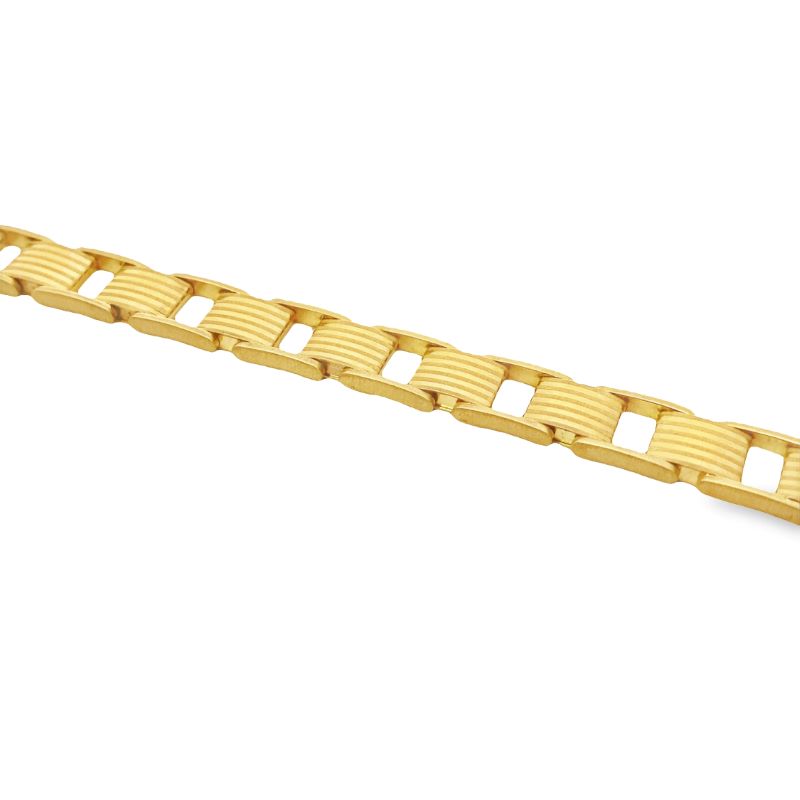 a yellow gold bracelet on a white background