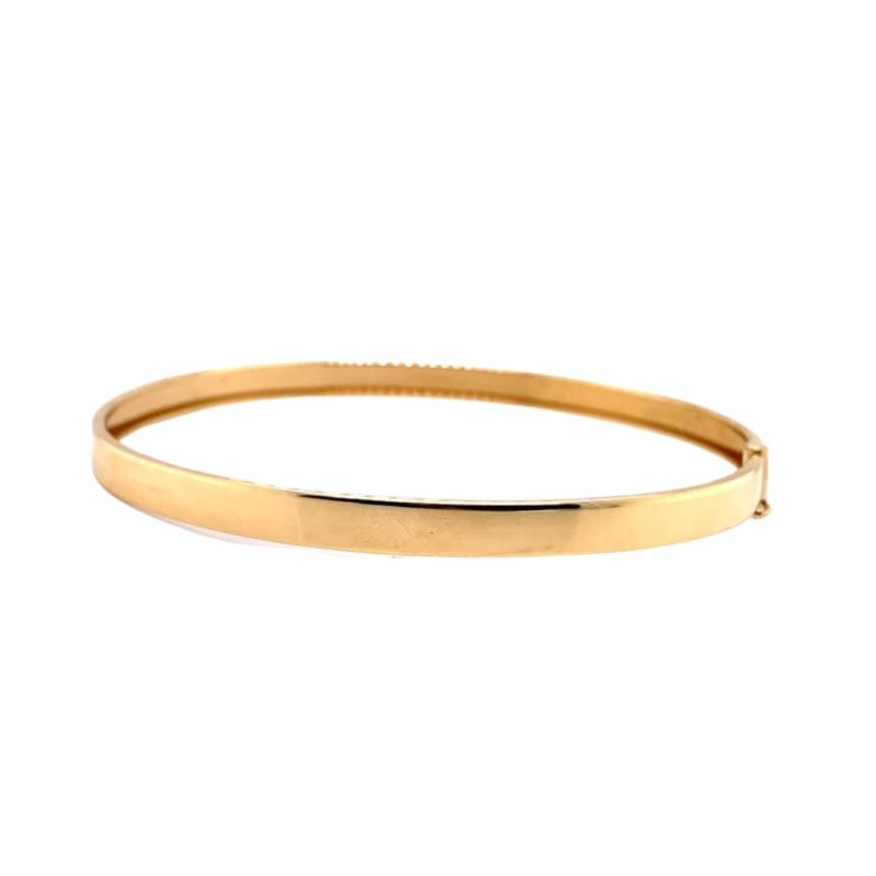 a gold bracelet with a thin band
