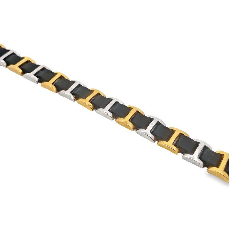 a gold and silver bracelet with black stones
