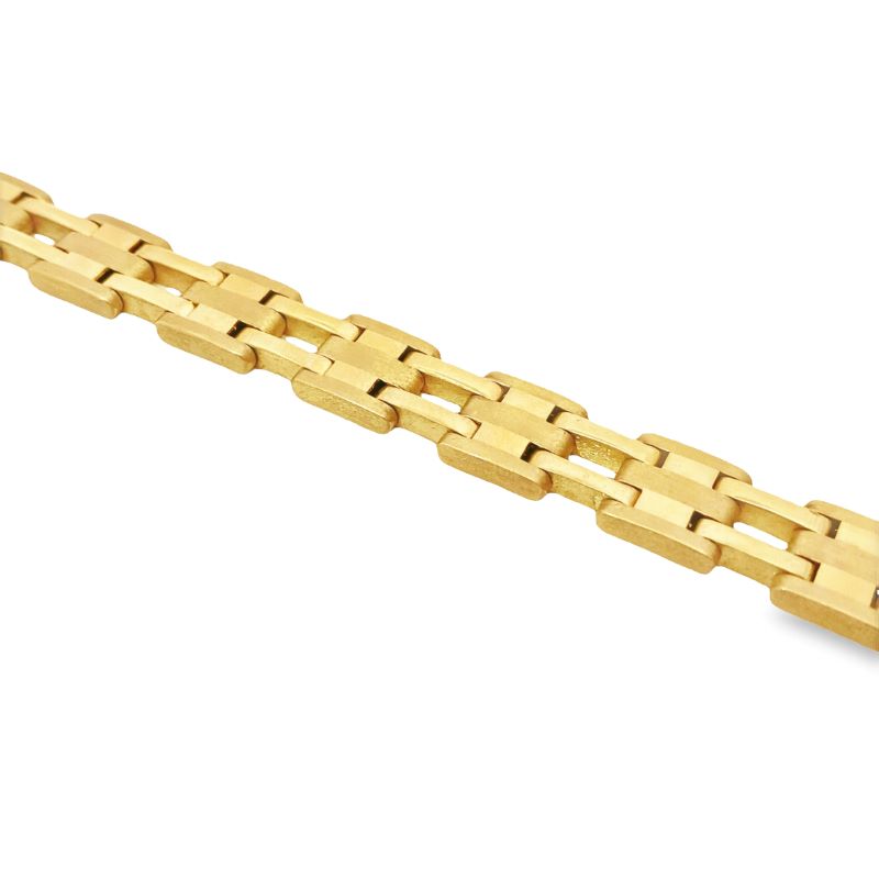 a yellow gold bracelet on a white background