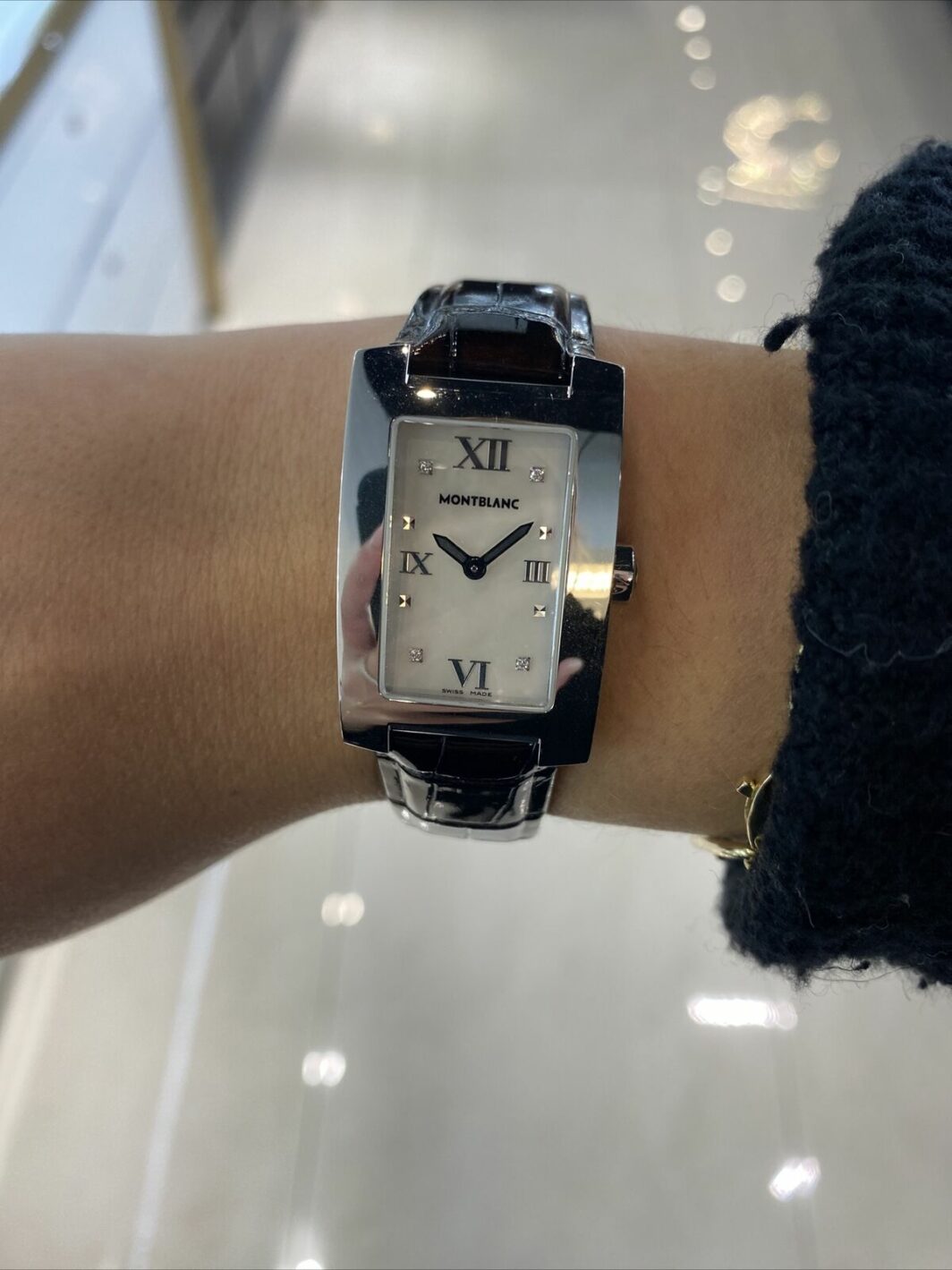 a woman's wrist with a watch on it