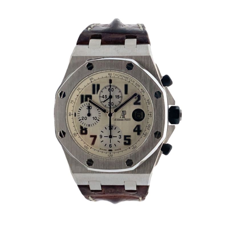 a watch with brown straps and white dials