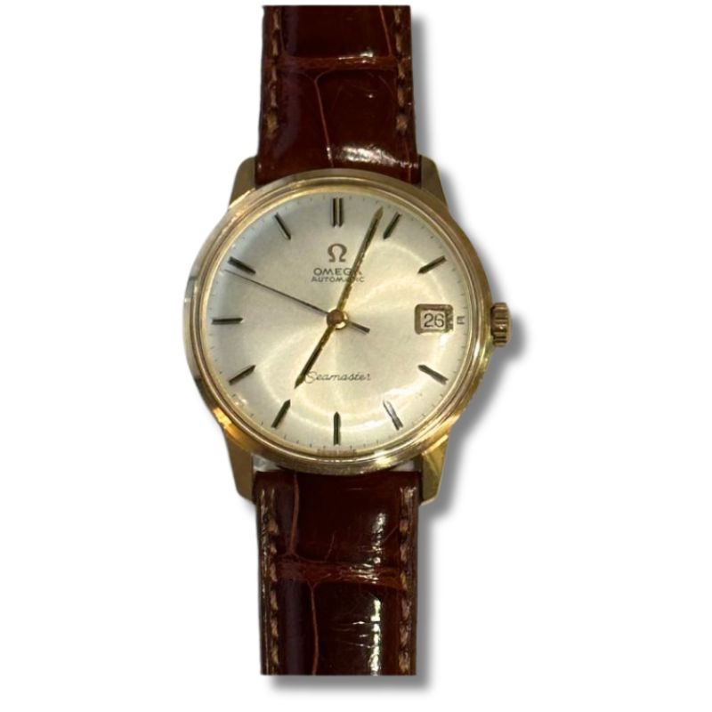 a gold watch with brown leather strap