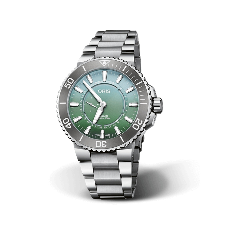 a watch with a green dial on a steel bracelet