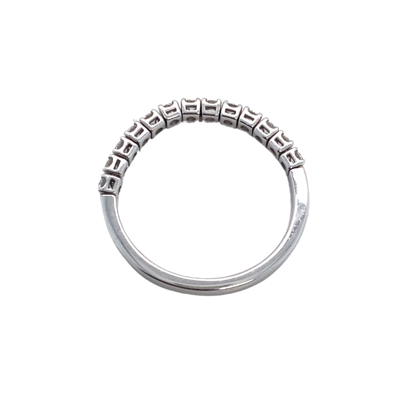 a silver ring with four rows of diamonds