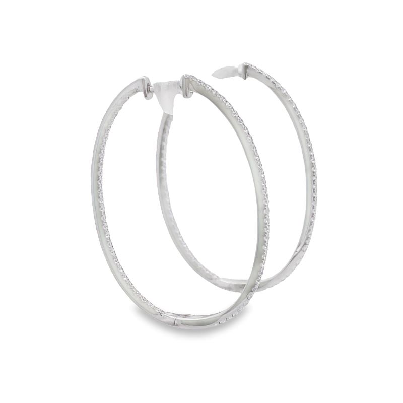 two white hoop earrings on a white background