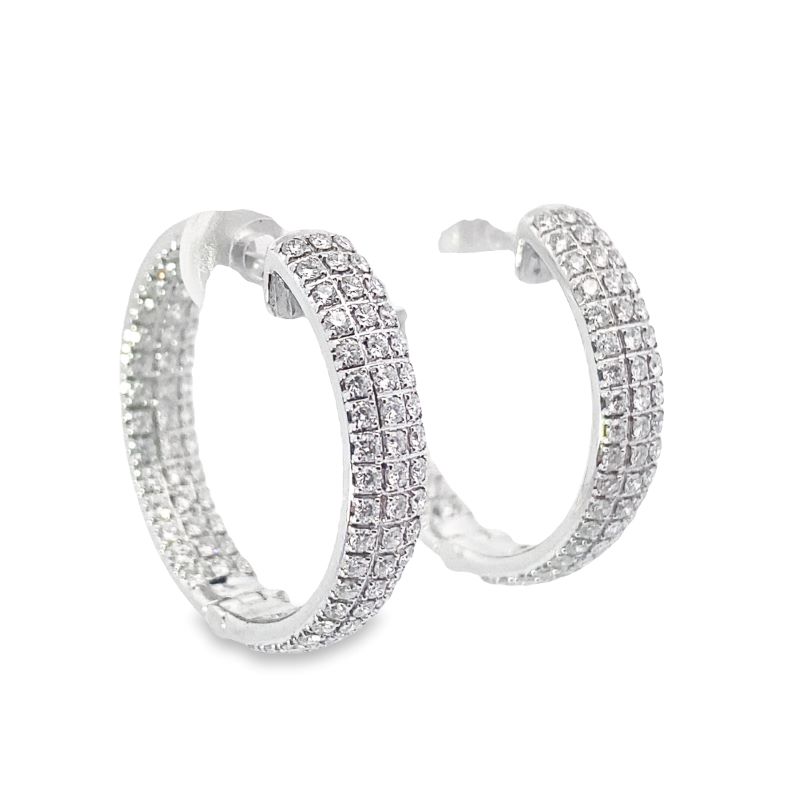 pair of hoop earrings with white diamonds