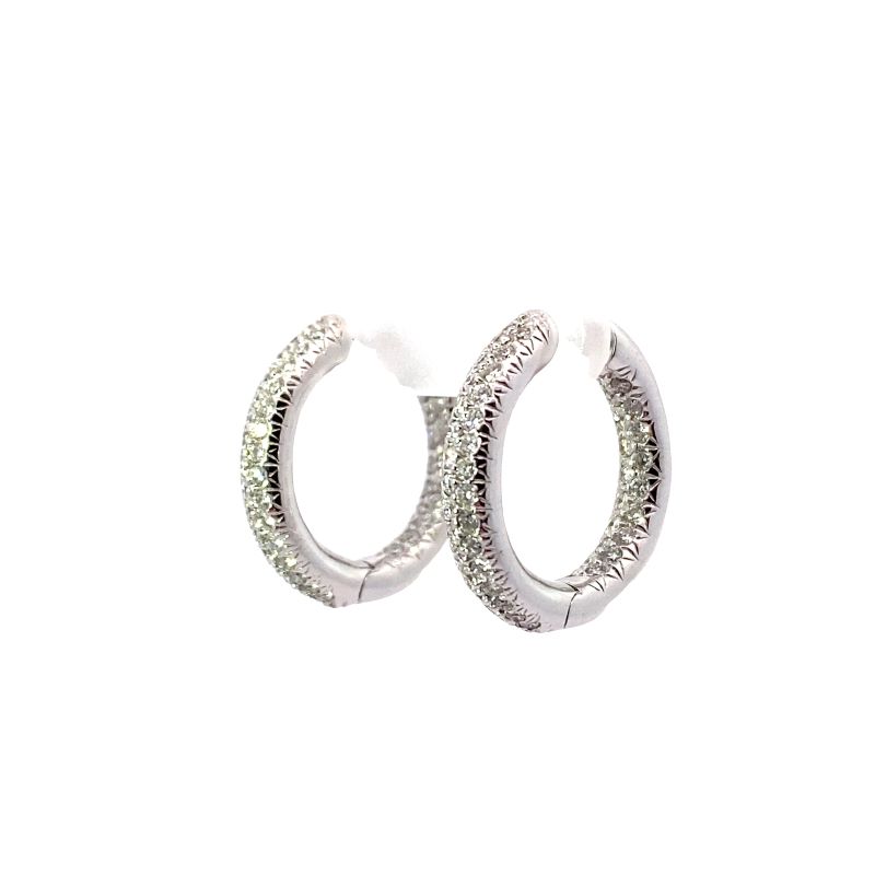 two silver hoop earrings with white diamonds