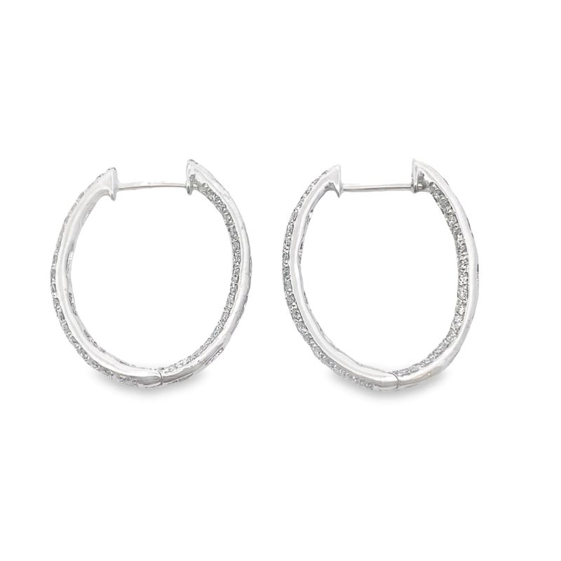 pair of silver hoop earrings with small diamonds